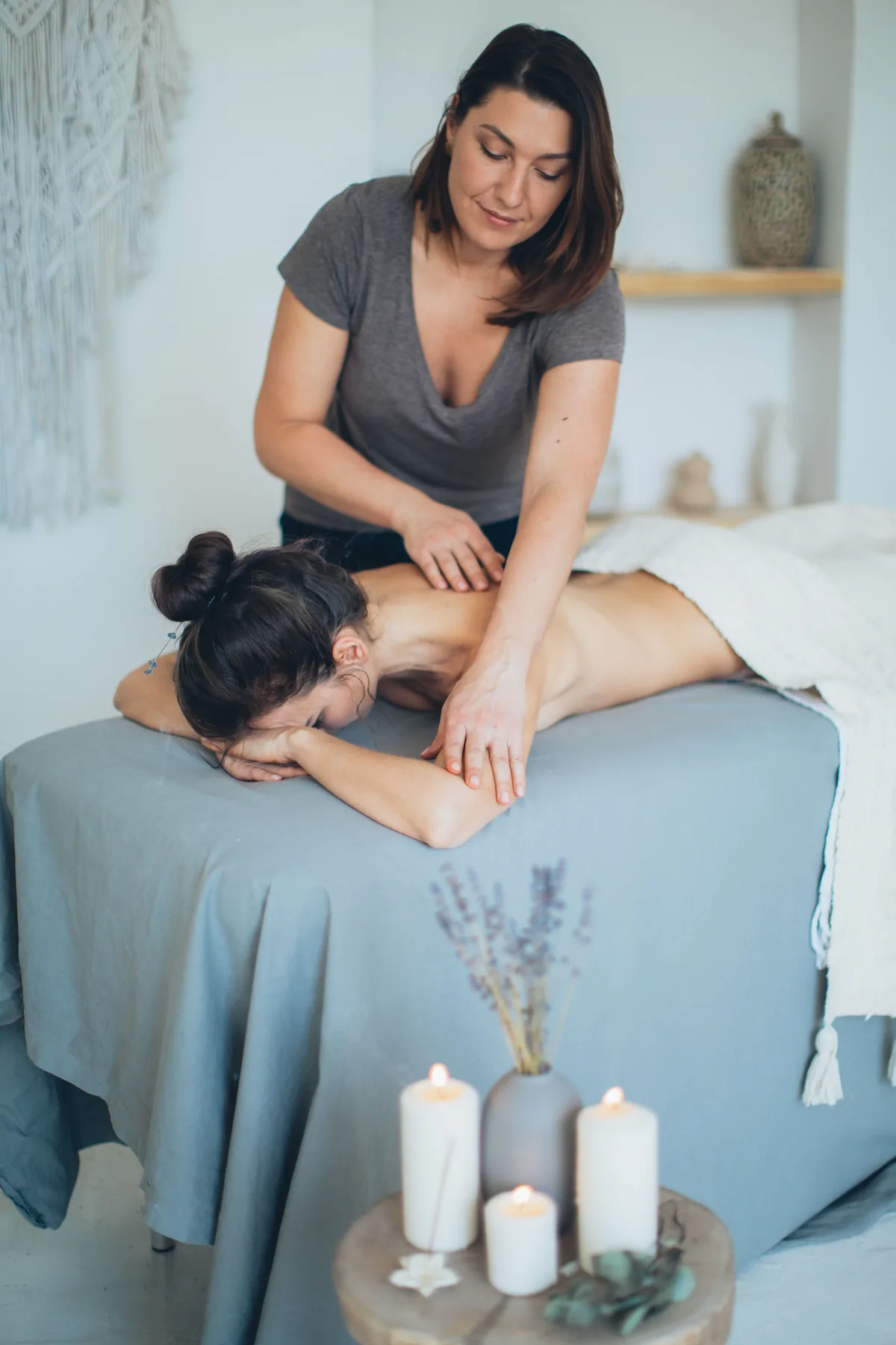 Professional back massage in a softly lit studio