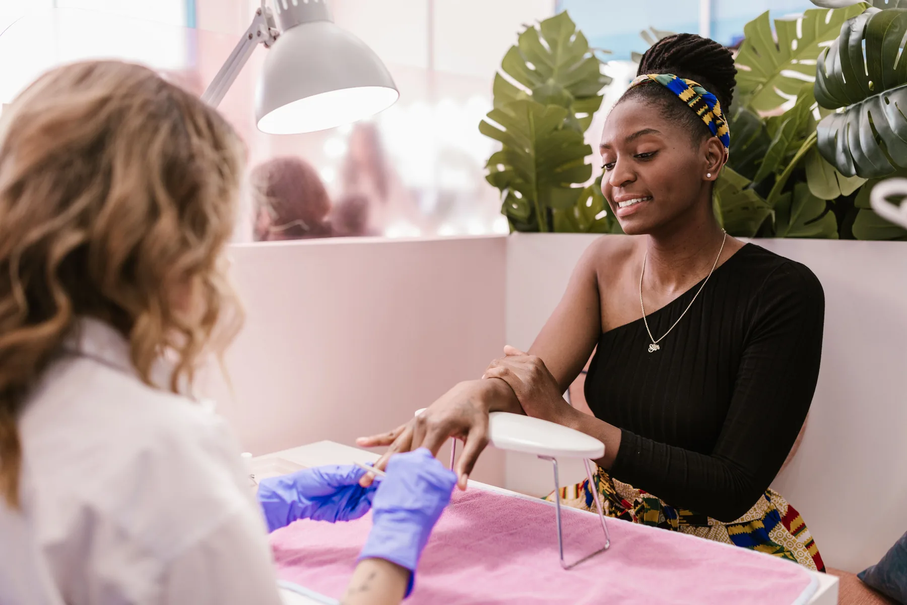 Client enjoying a manicure in a modern salon
