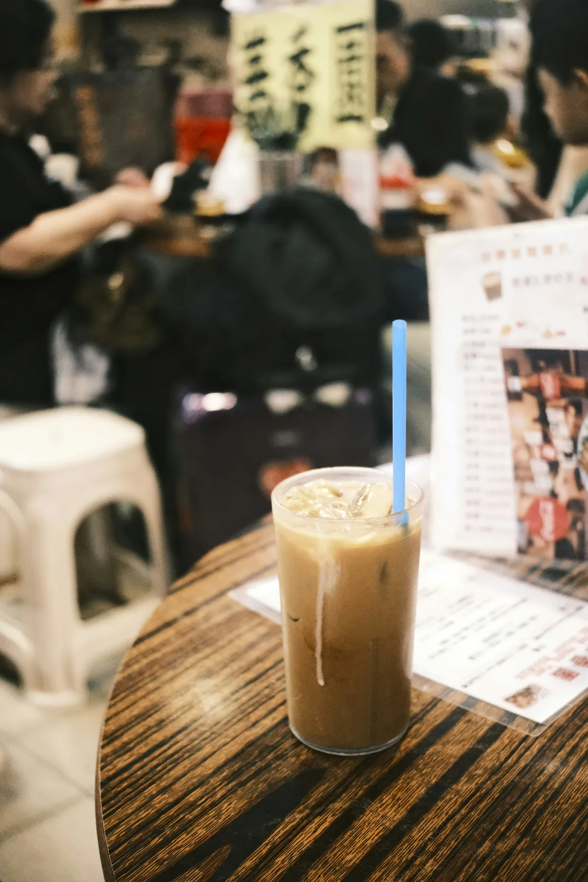 Creamy iced milk tea on a wooden table